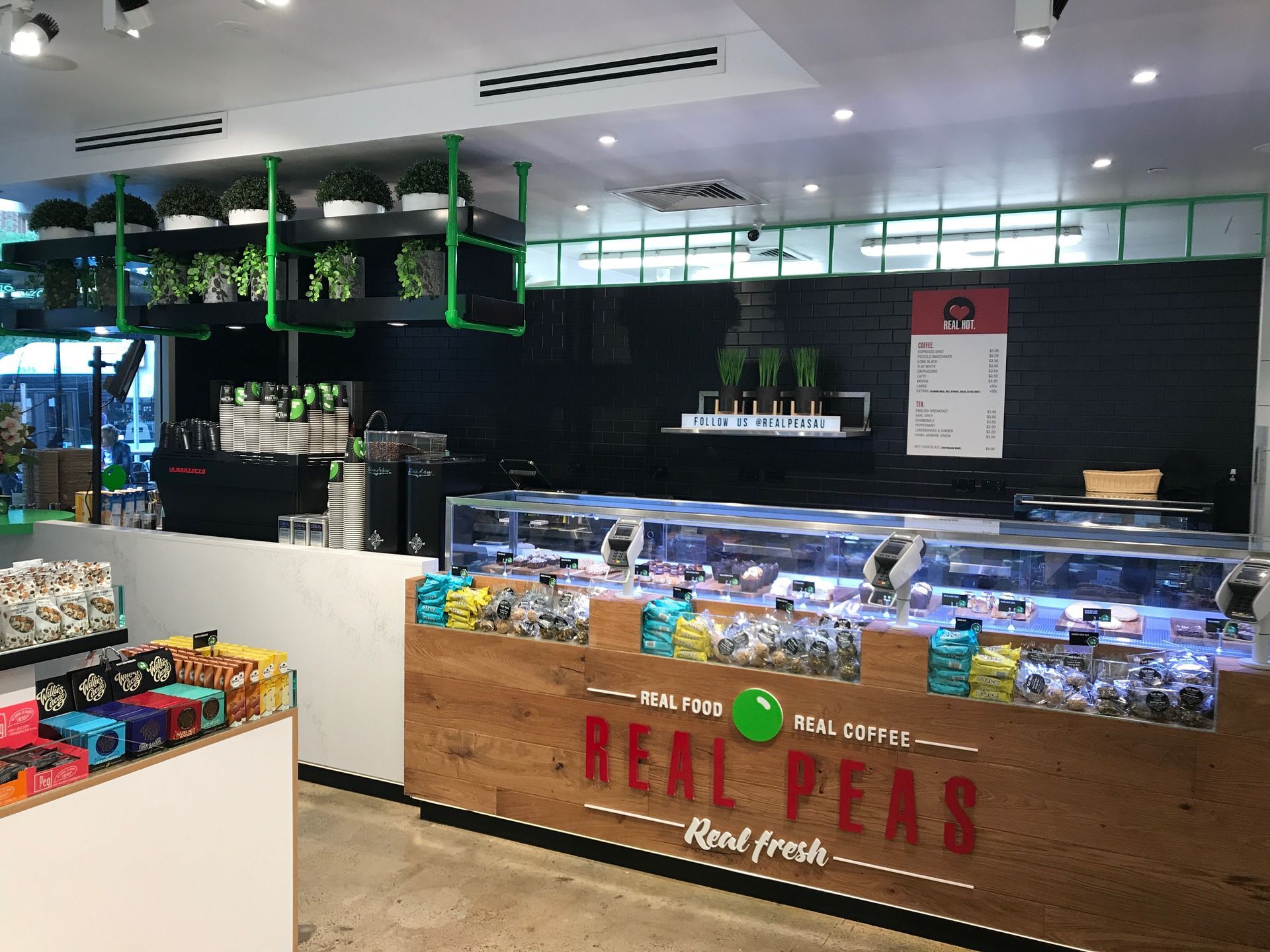 A Store Called Real Peas With A Counter And Glass Display Case — Nyon Shopfitters in Morisset, NSW