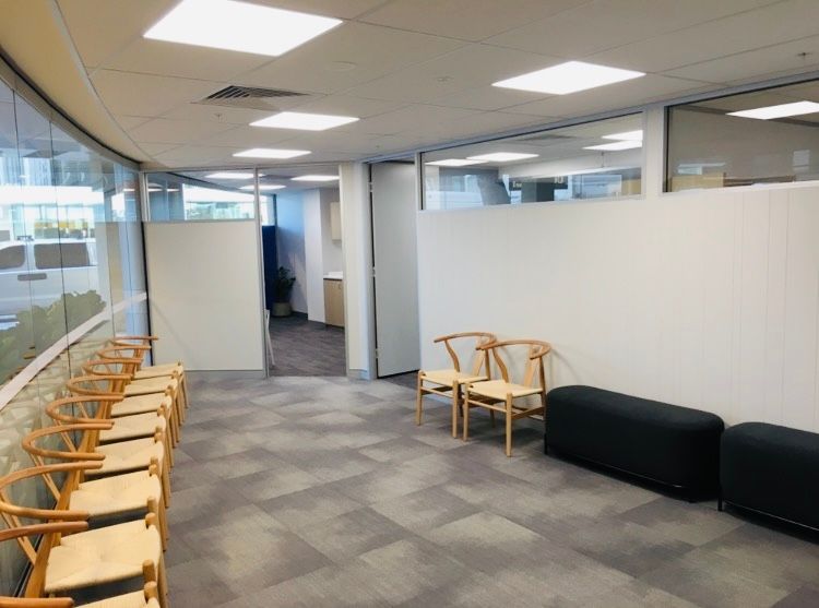 A Waiting Room With A Row Of Chairs And A Bench — Nyon Shopfitters in Morisset, NSW