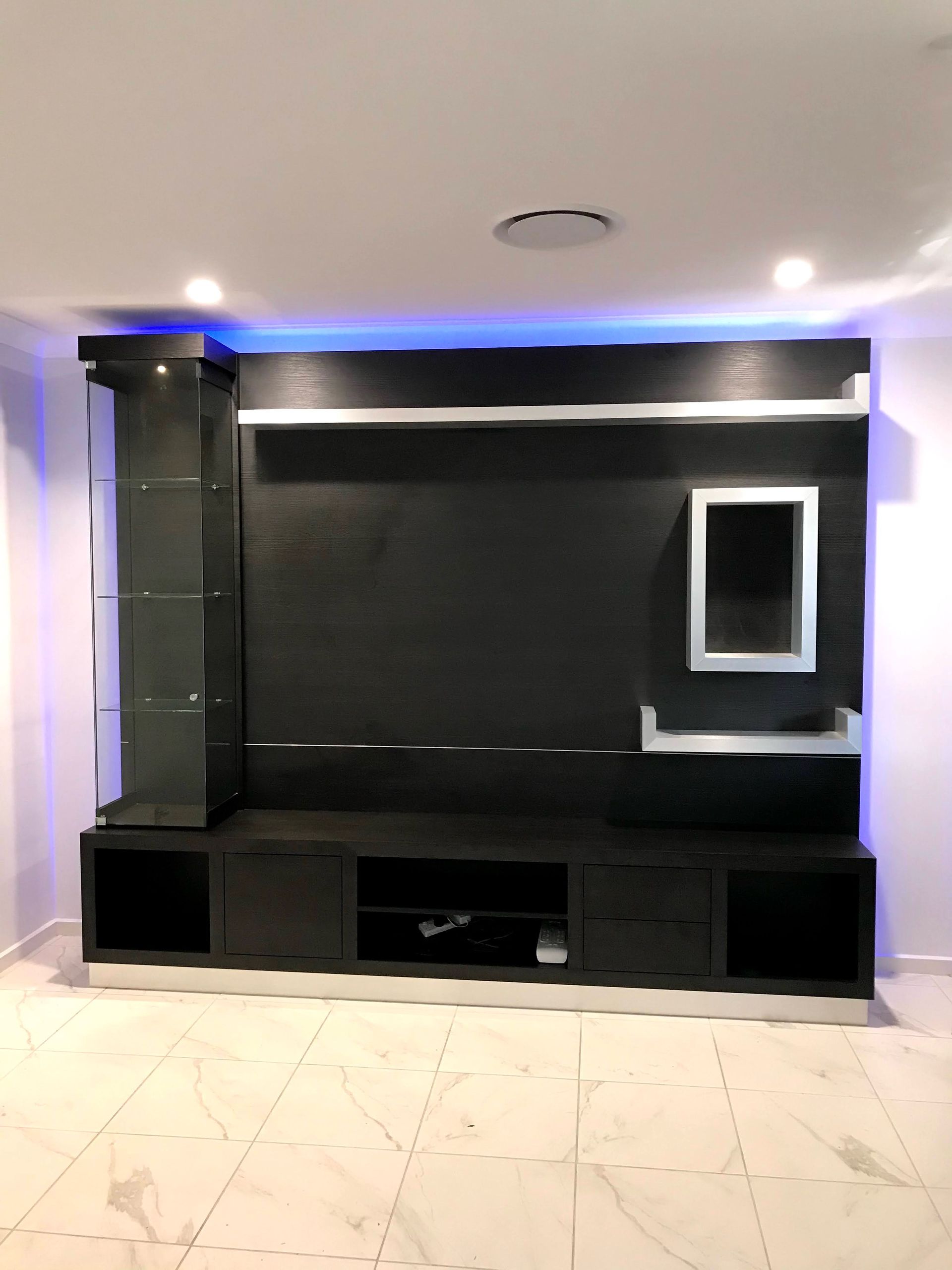 A Large Black Cabinet System With Back Lighting — Nyon Shopfitters in Morisset, NSW