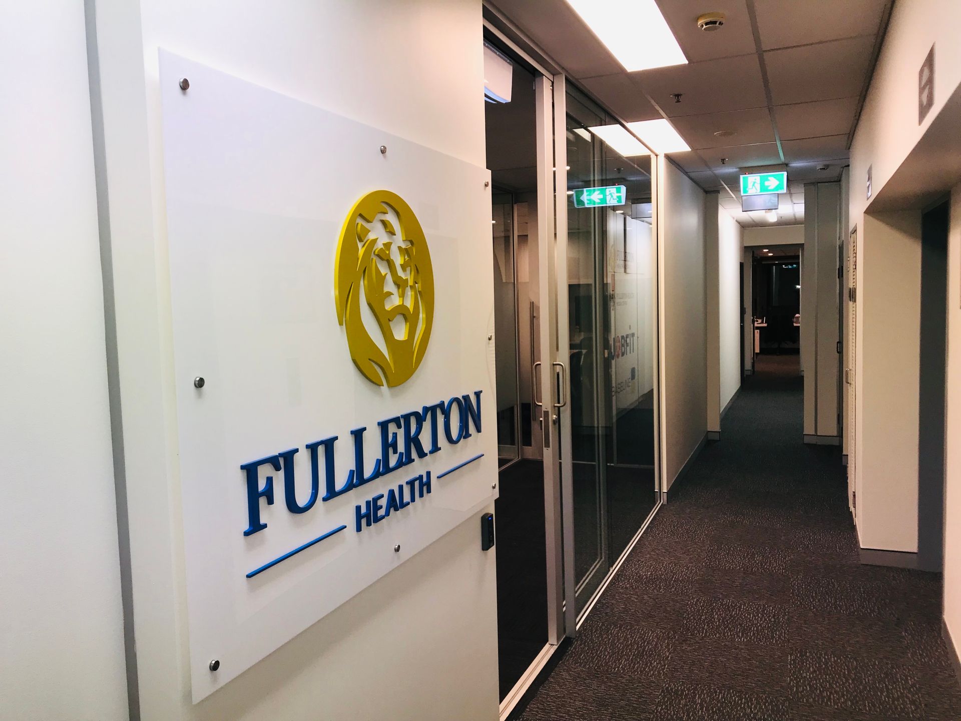A Hallway With a Sign That Says Fullerton Health — Nyon Shopfitters in Morisset, NSW