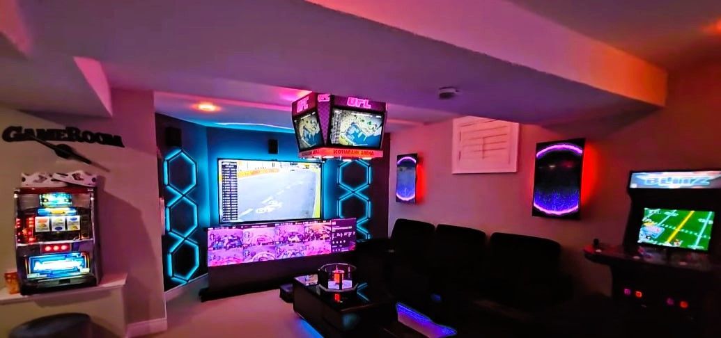 Cozy and inviting basement game room featuring comfortable seating, vibrant gaming consoles, and immersive LED lighting