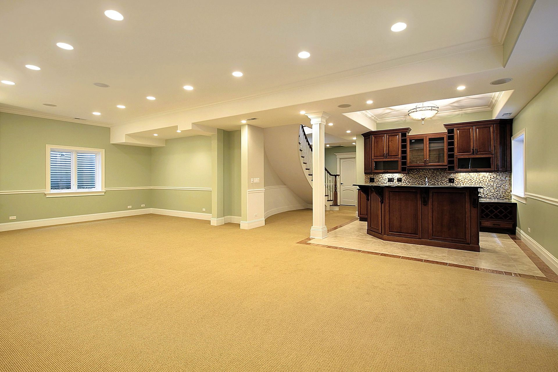 Image of a newly renovated basement with a bar area