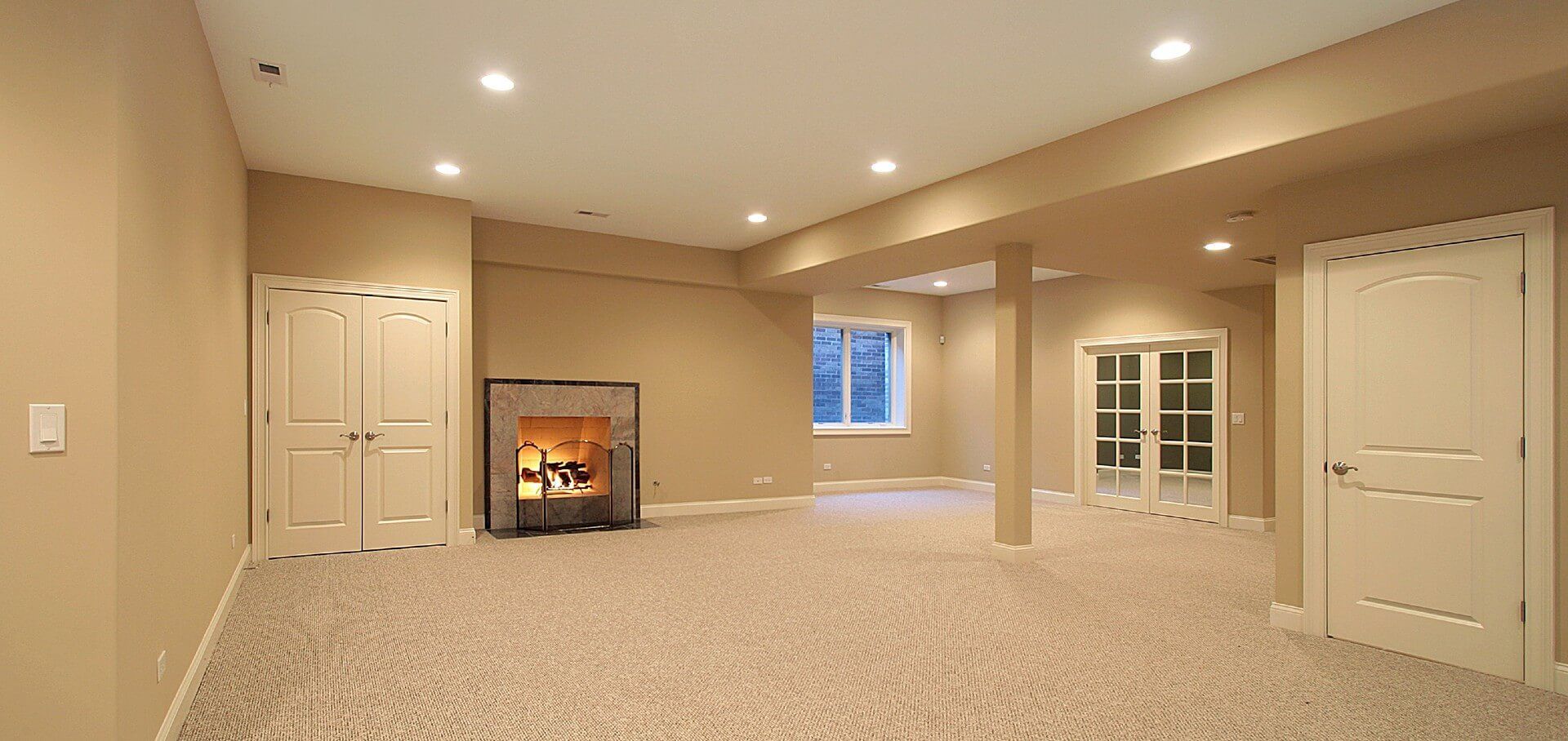 A clean, spacious, and expansive finished basement ready for transformation