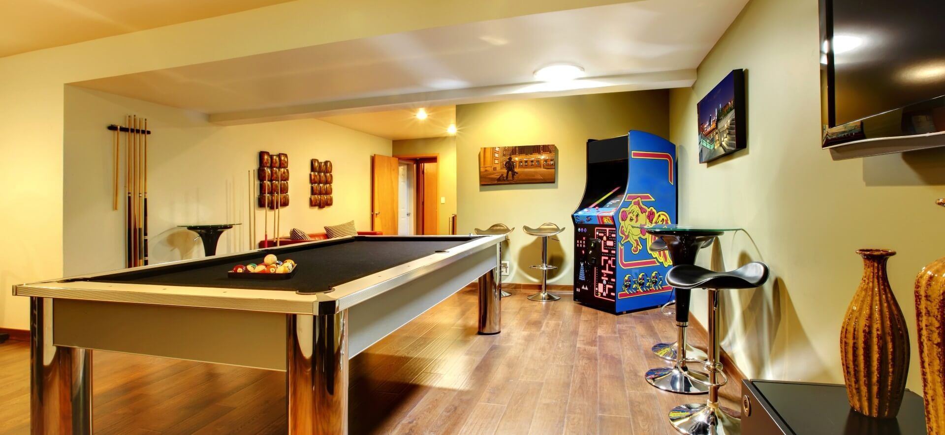 A basement transformed into a game room for friends and family to use and spend time in together