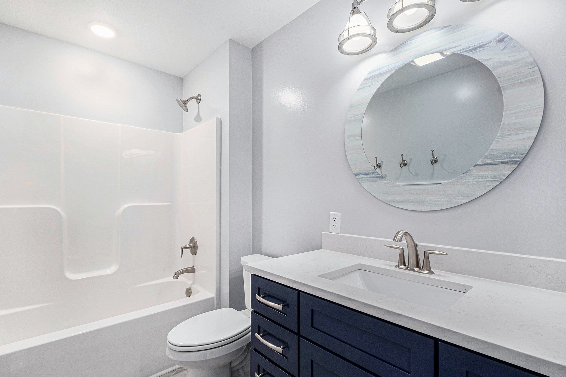 bright new bathroom with sink tub and shower