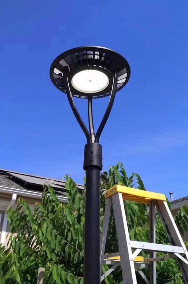 a ladder is sitting next to a street light
