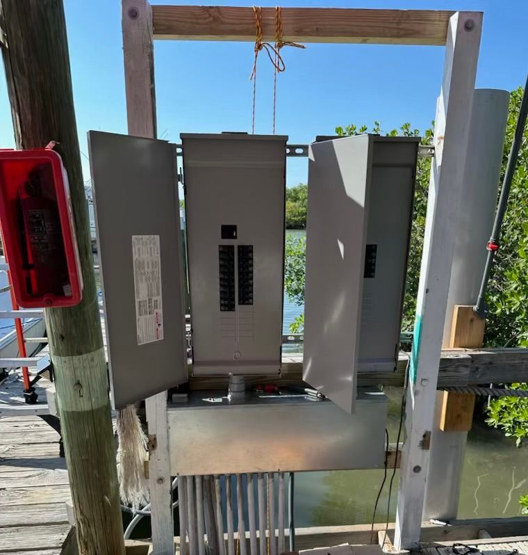 A large electrical box is hanging from a wooden frame