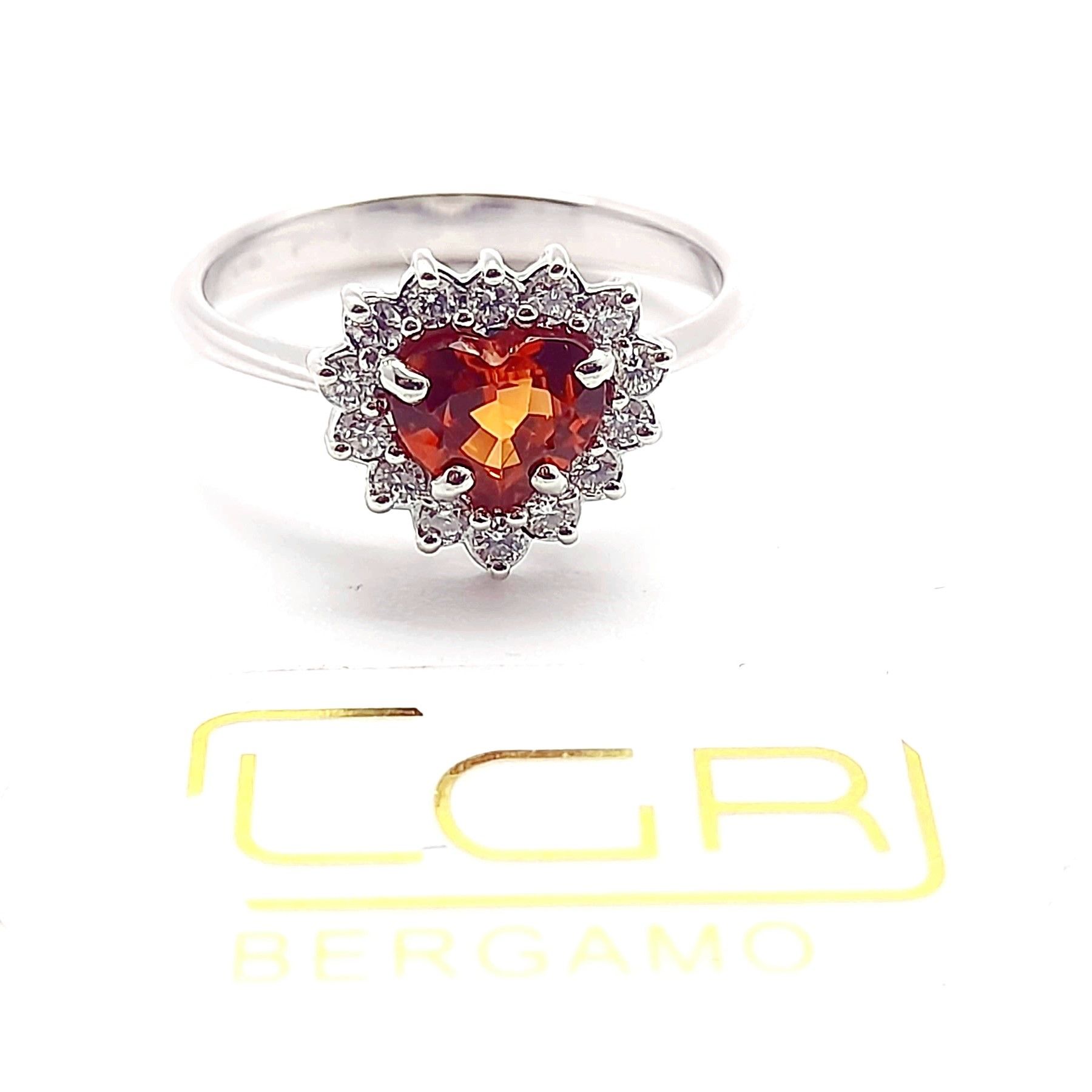Anello in oro bianco con spessartite e brillanti