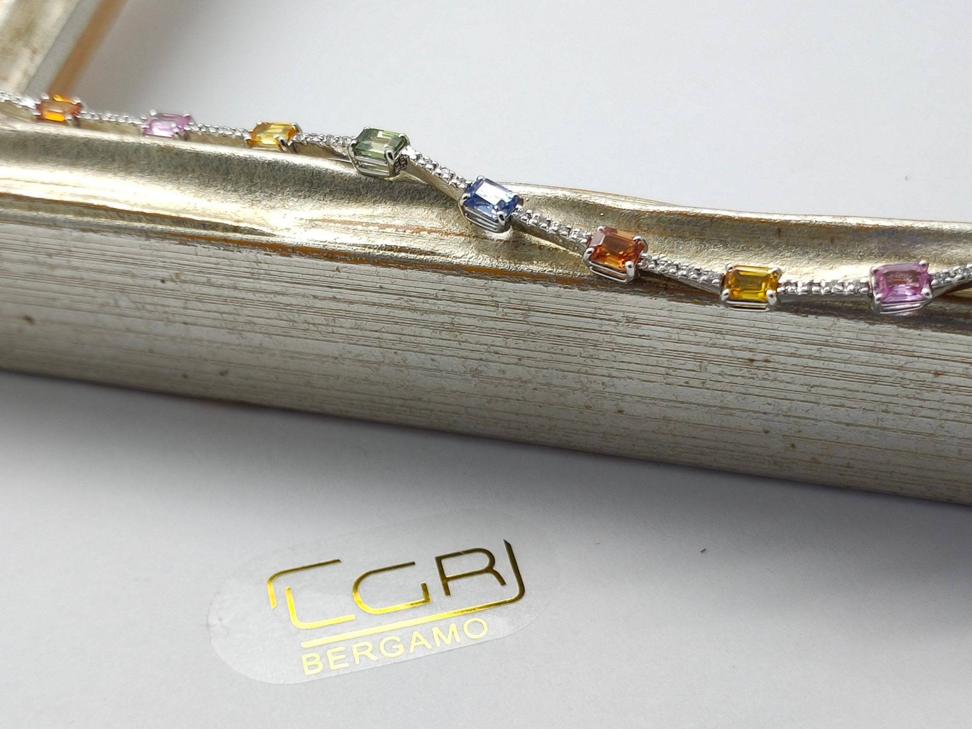 tennis oro bianco con zaffiri multicolor e diamanti