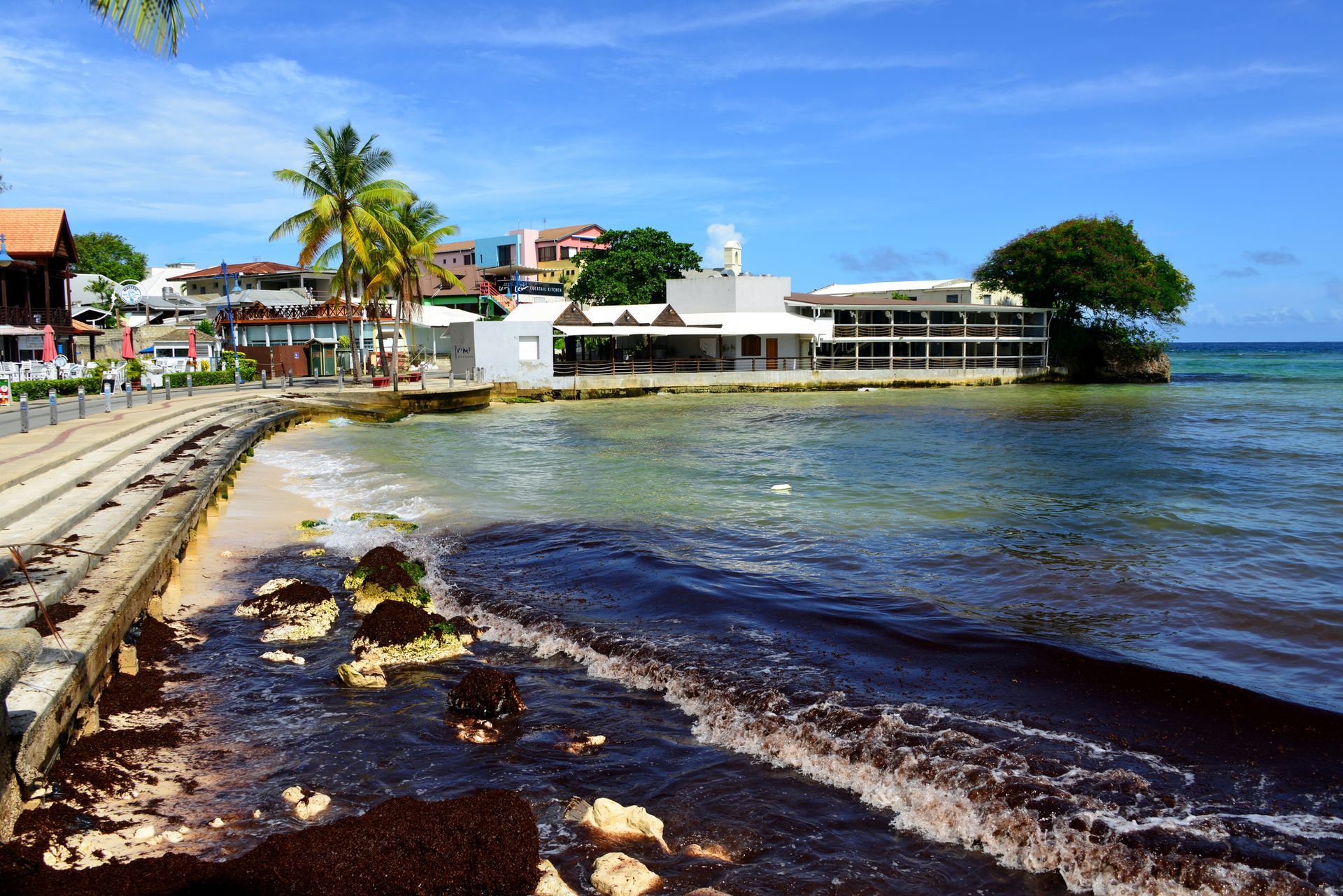 A large body of water with buildings in the background
