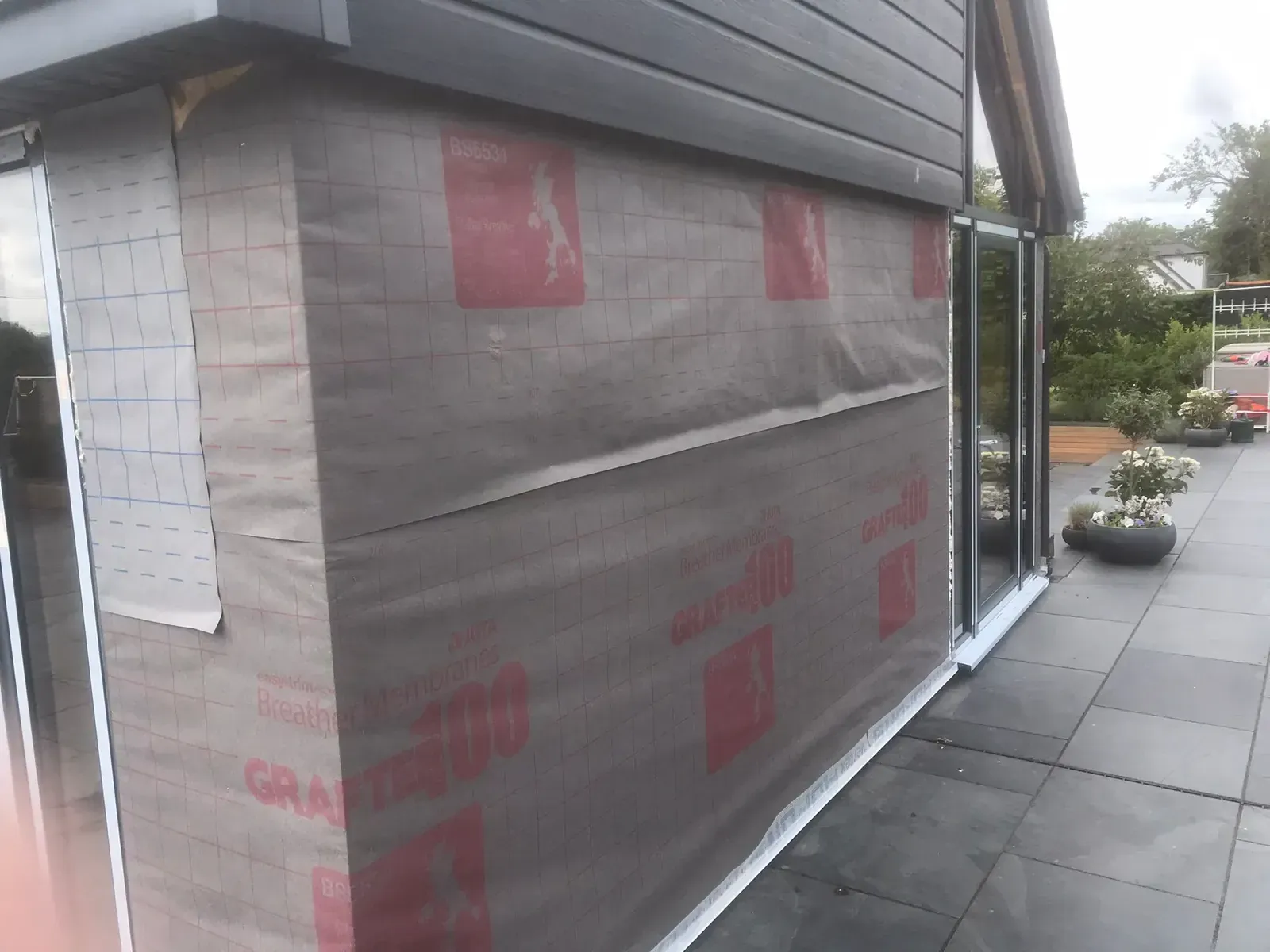 Garage conversion exterior before EWI and silicone rendering in Leigh-on-Sea, Essex.