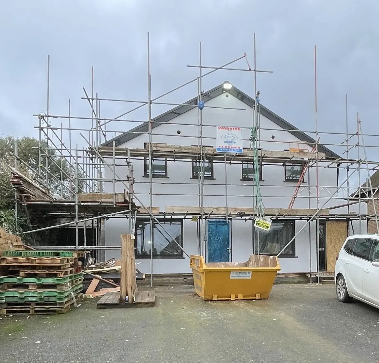 Freshly rendered house exterior with scaffold in Braintree, Essex