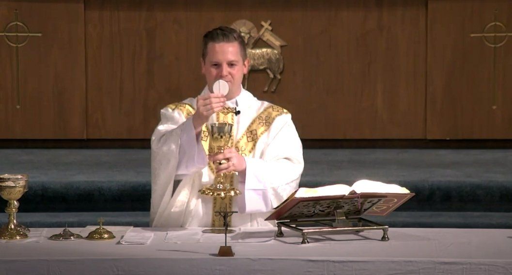 Fr. Ginter with Holy Eucharist
