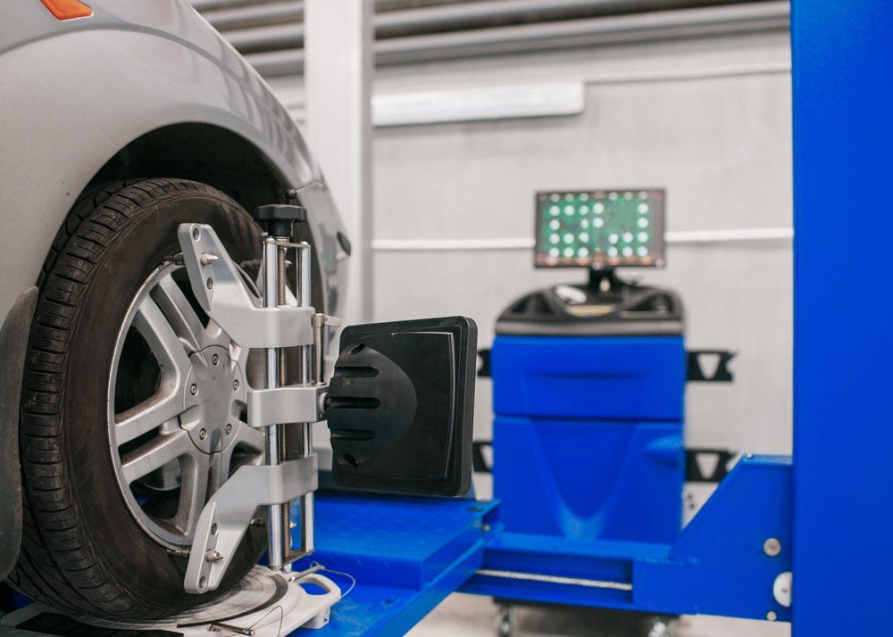 Car on Stand with Sensors Wheels — Butler, PA — West End Tire & Service