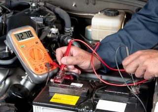 Auto Mechanic Checking Car Battery Voltage — Butler, PA — West End Tire & Service