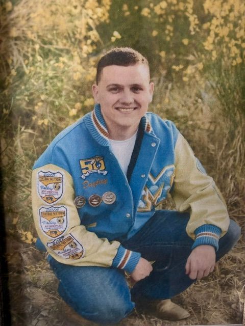 Custom varsity jacket in navy and gold with chenille letter