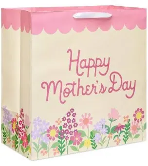 A happy mother 's day gift bag with flowers on it