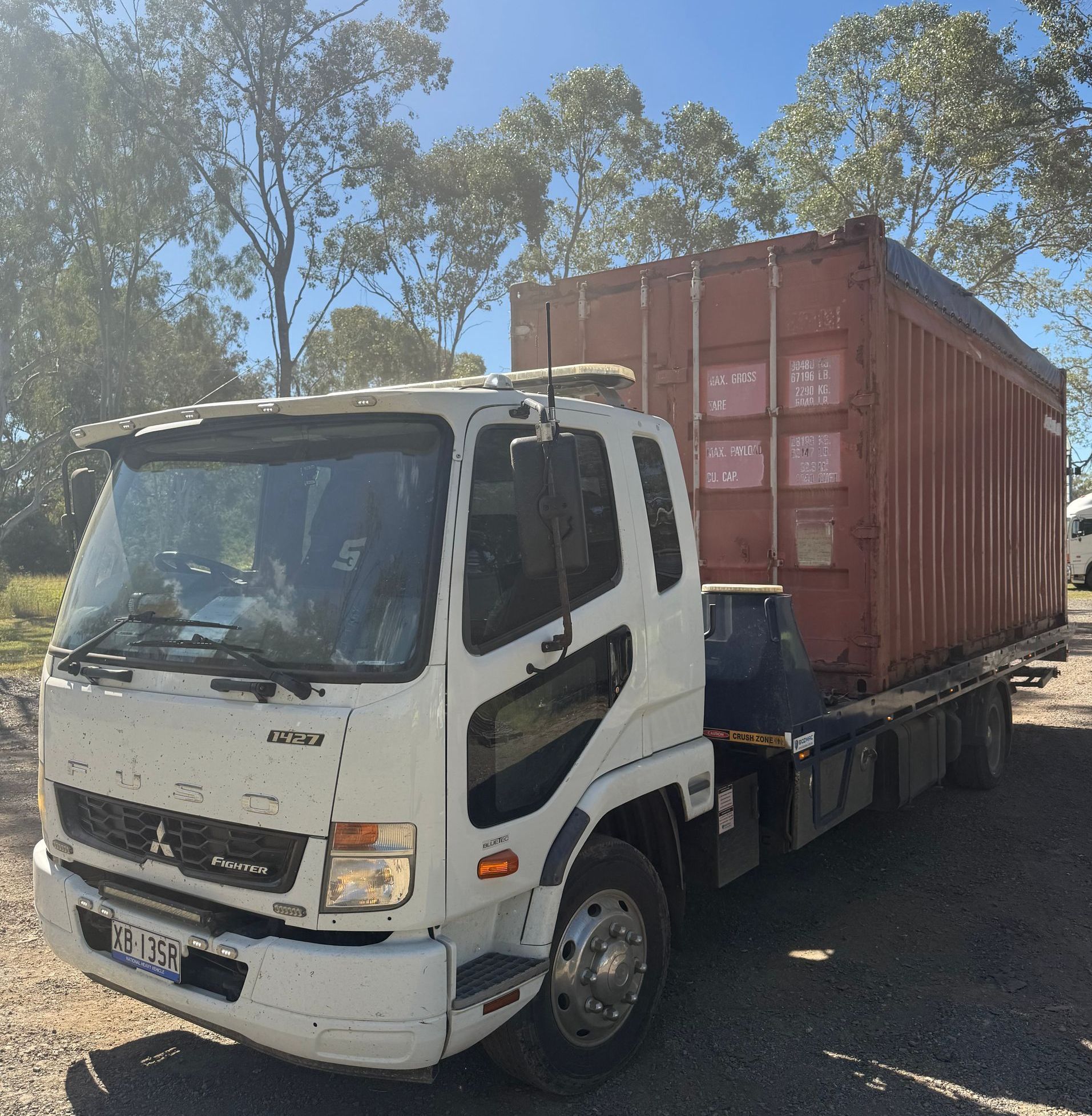 A Car Is Being Towed By A Tow Truck  — Rockhampton Towing And Transport in Gracemere, QLD