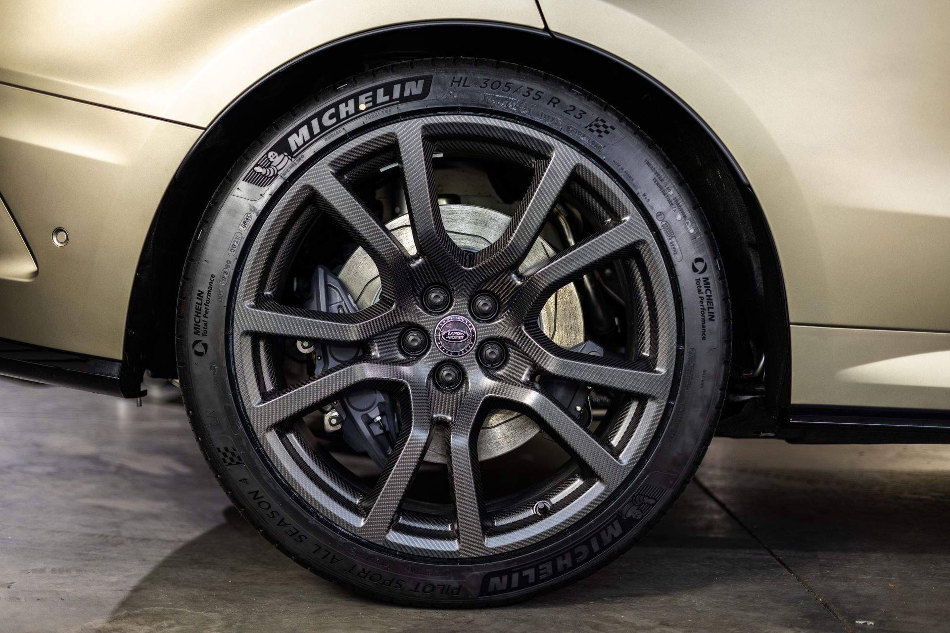 A close up of a car wheel with a michelin tire on it.