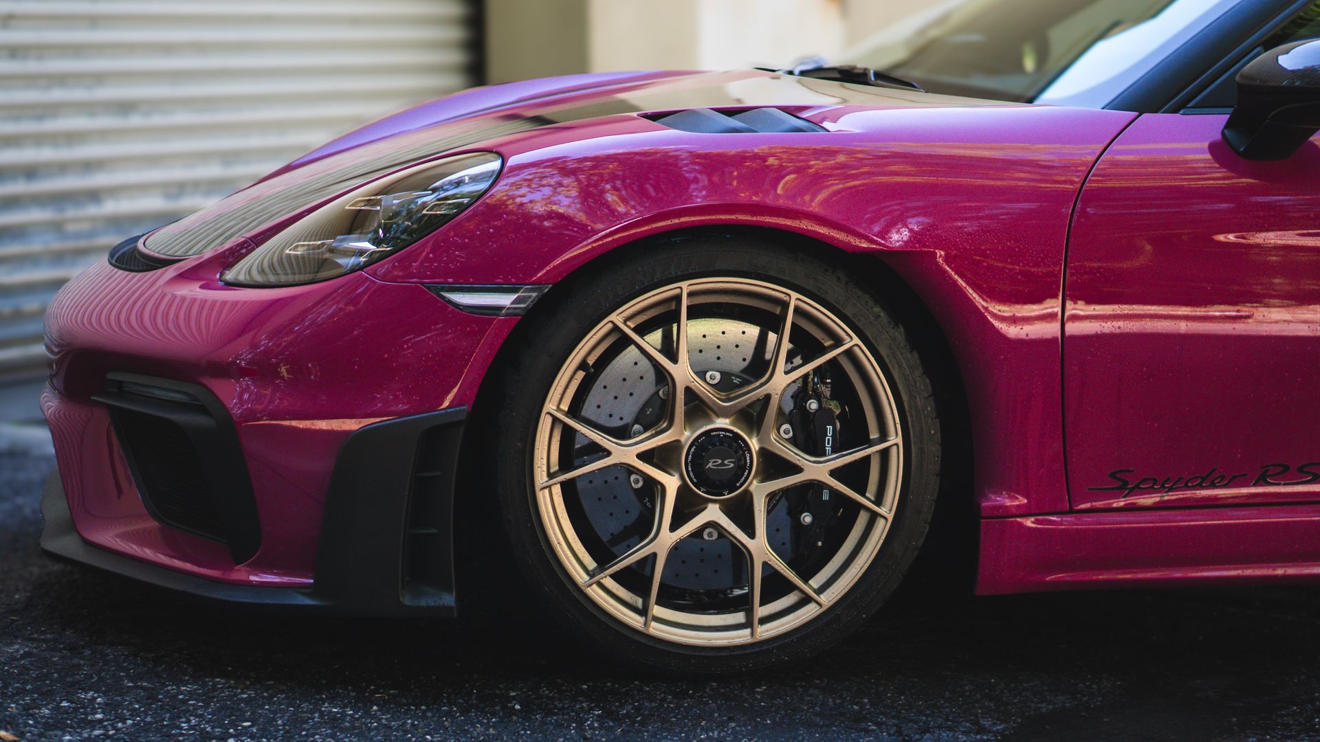 A blue and white sports car on a white background.