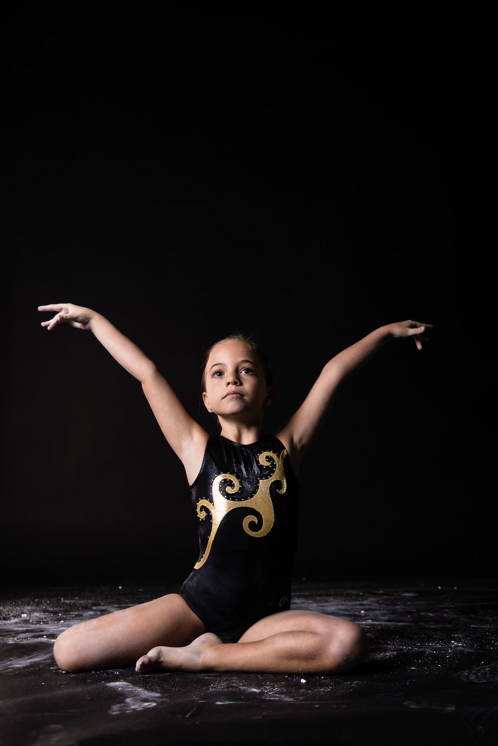 A Gymnast Girl Raising Hands — Gold Medal Gymnastics In Gold Coast, QLD