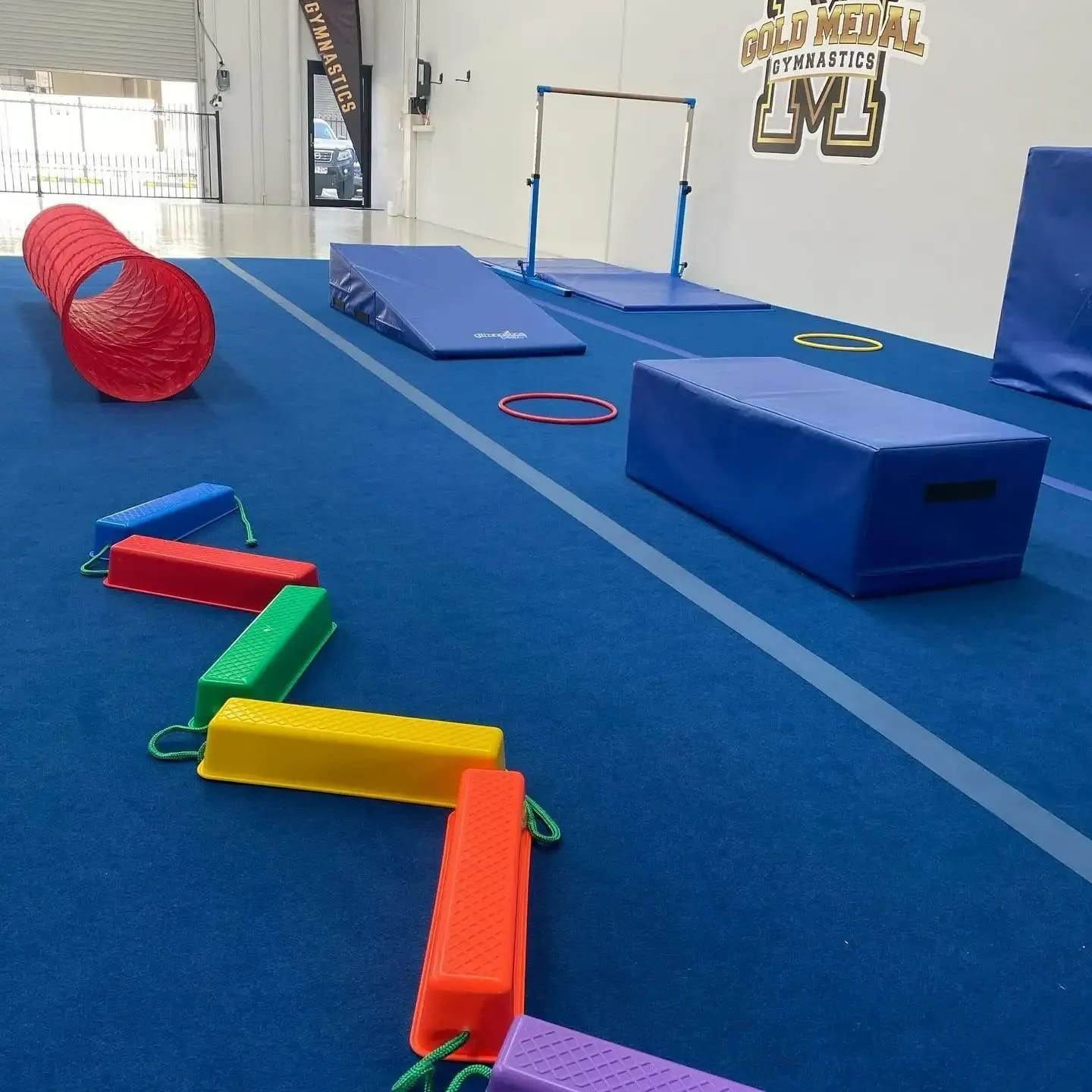 A Gym With A Sign That Says Gold Medal Gymnastics — Gold Medal Gymnastics In Gold Coast, QLD