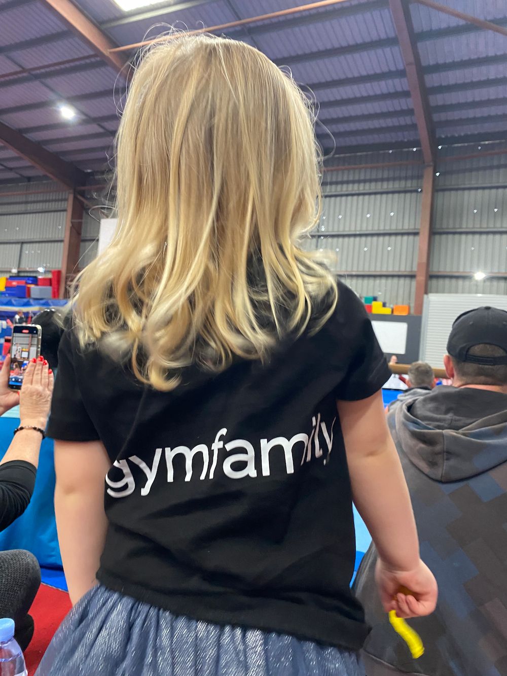 A Little Girl Wearing A Black T-shirt  — Gold Medal Gymnastics In Molendinar, QLD