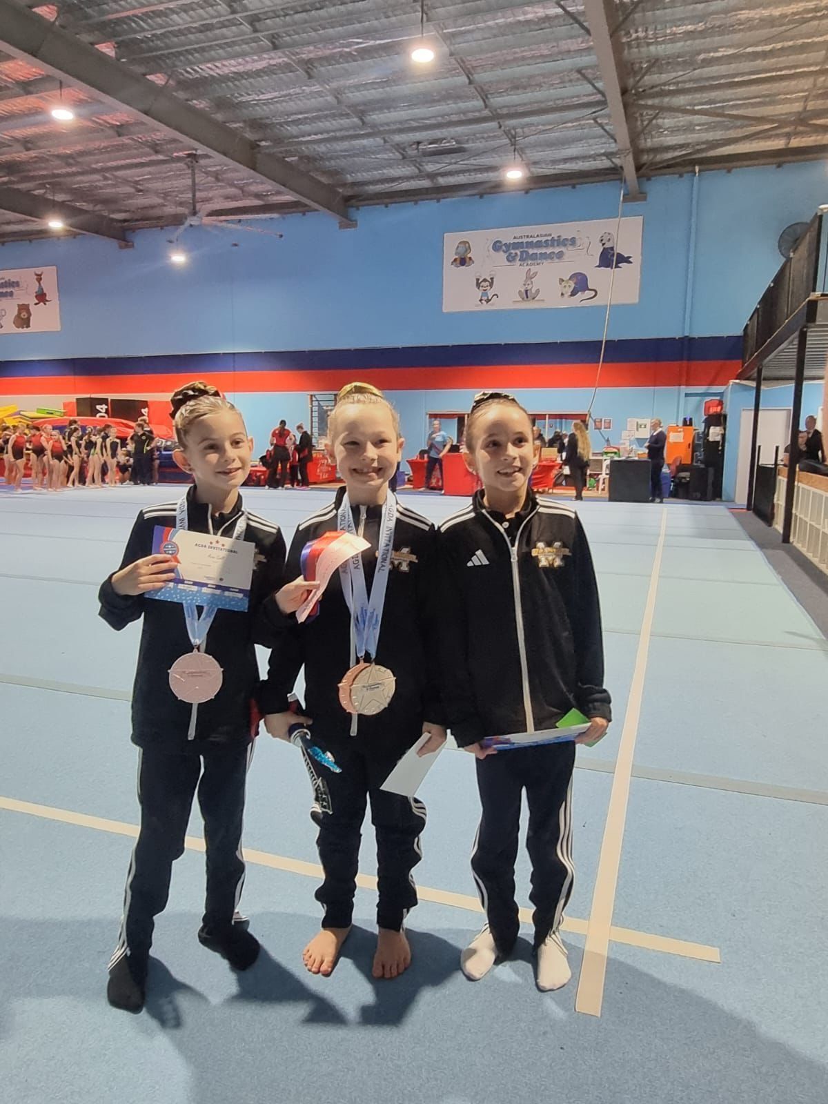 Youngs Girls Wearing Medal — Gold Medal Gymnastics In Gold Coast, QLD