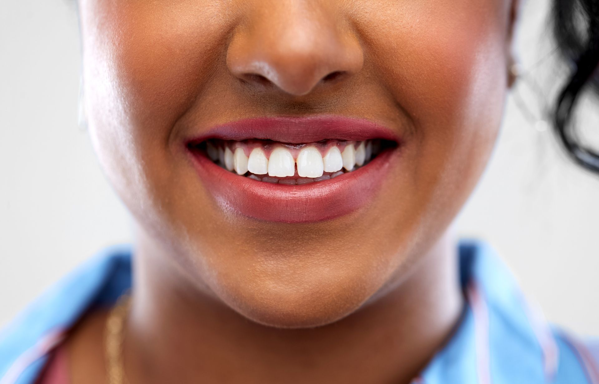 close up of woman smiling with gap in teeth