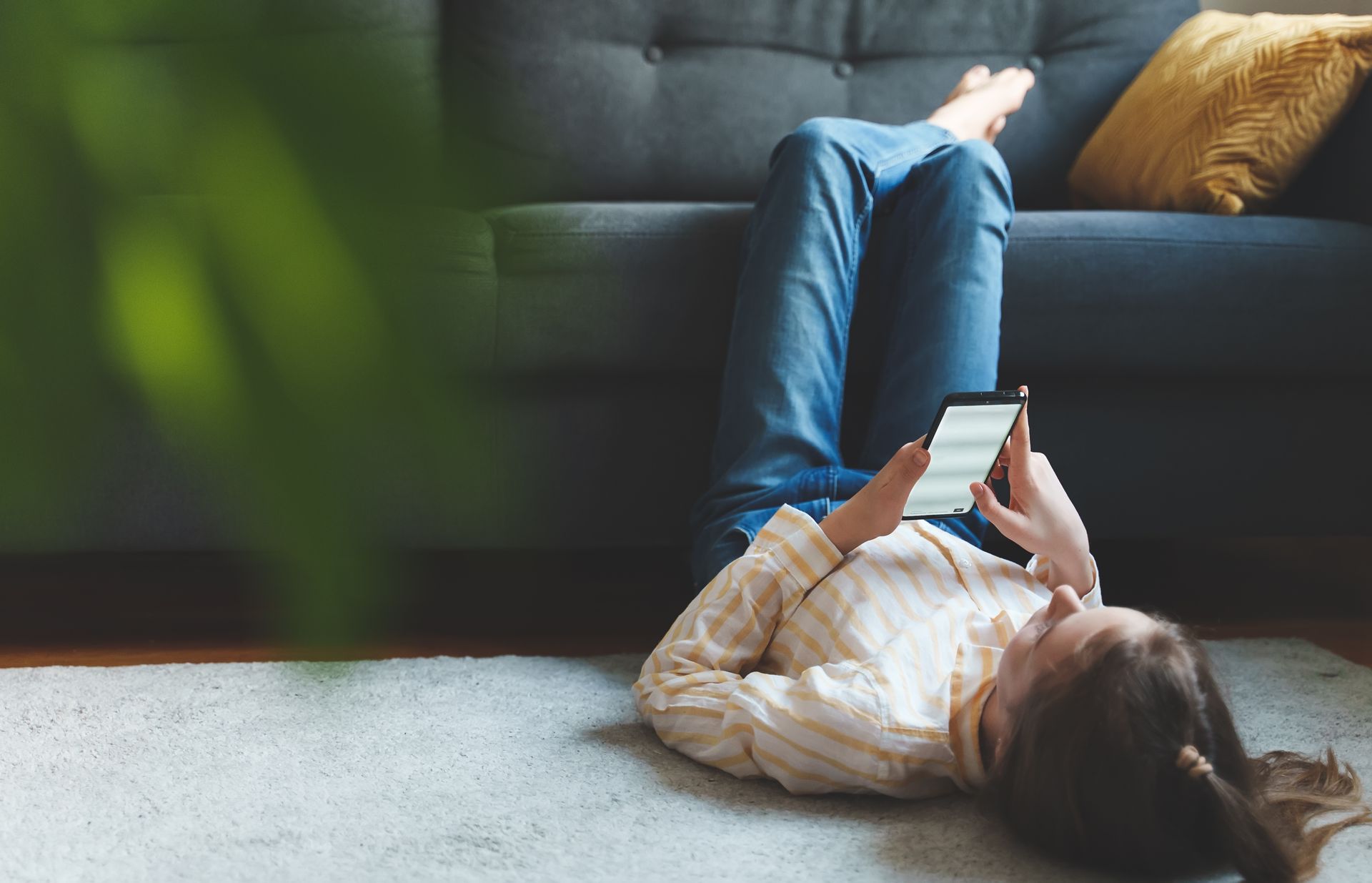 teen using phone at home