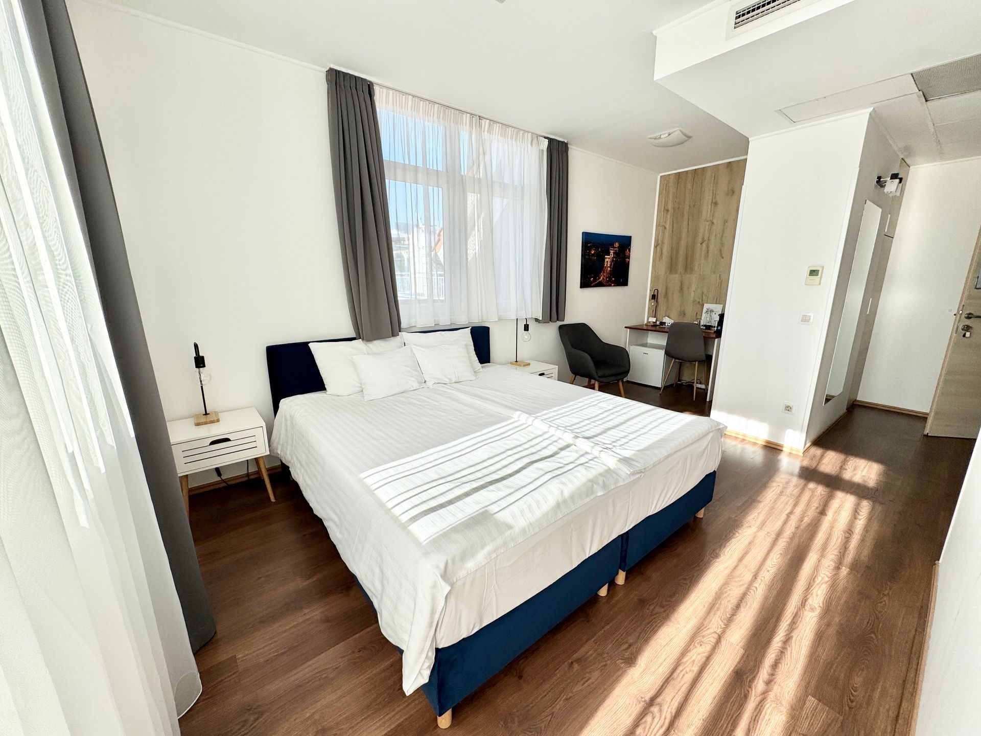 There is a large bed in the middle of the room.