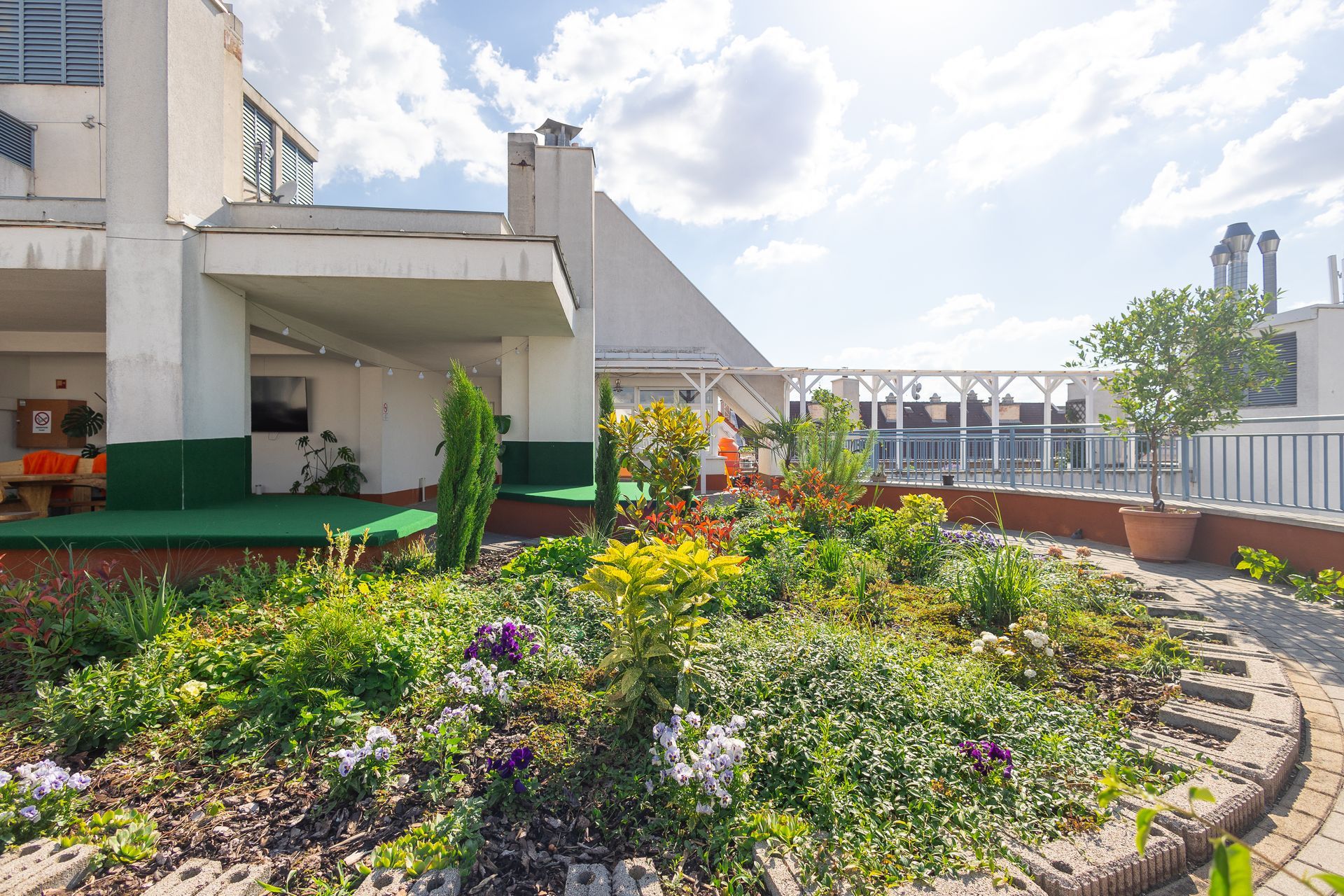 There is a garden on the roof of a building.