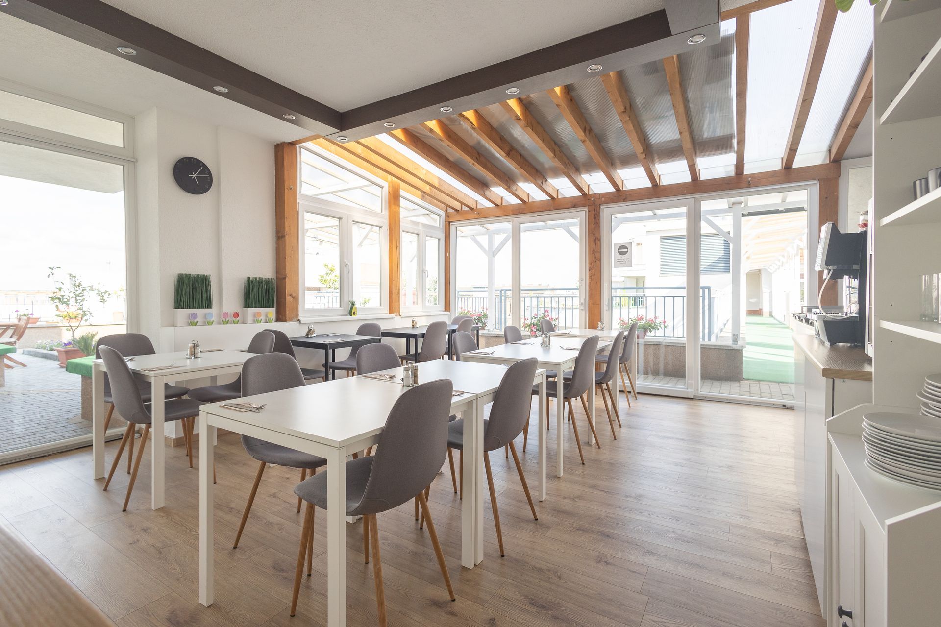 A large room with tables and chairs in it.