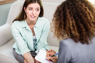 woman speaking with female therapist