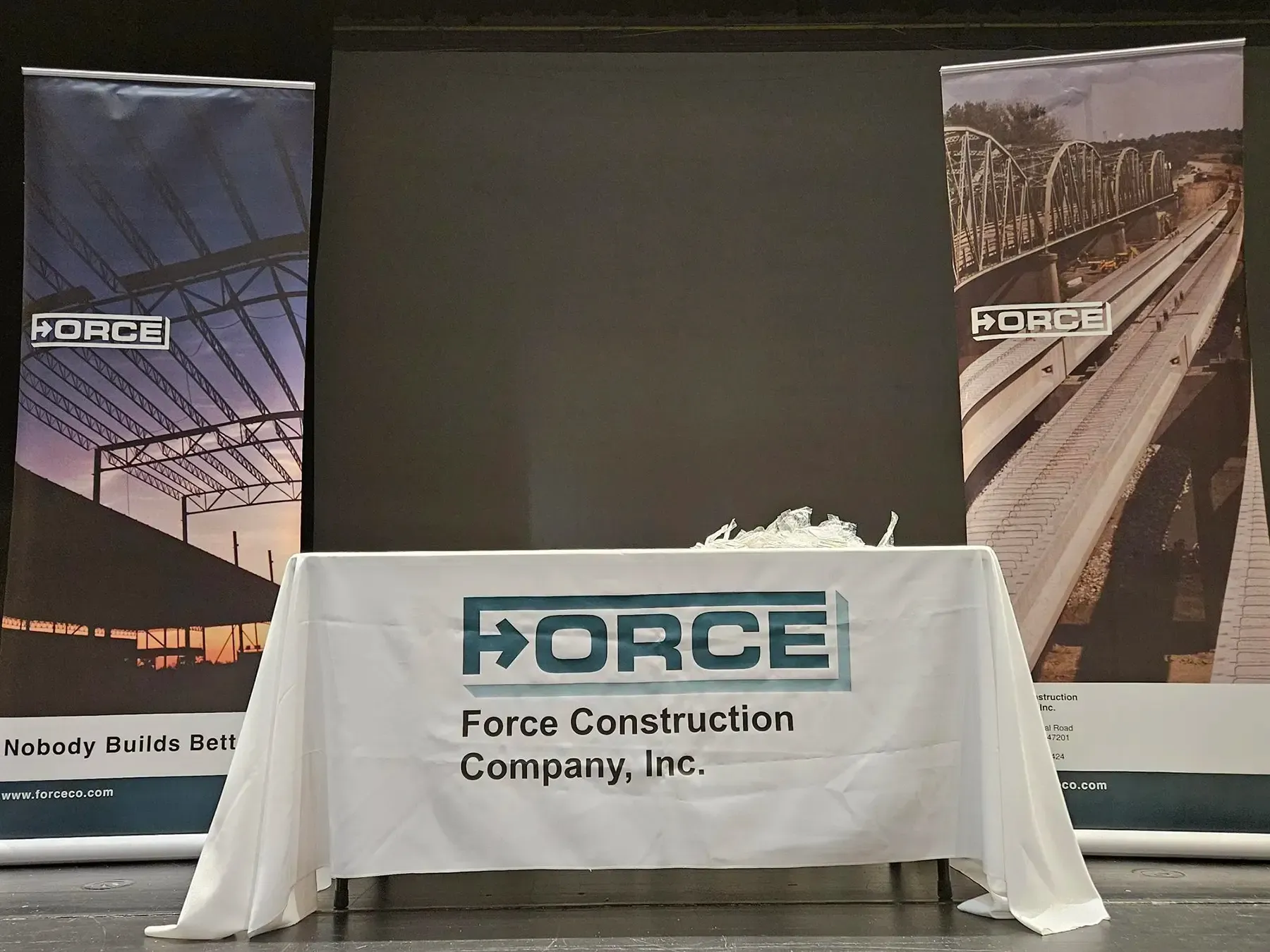 A table with the Force Construction logo on it