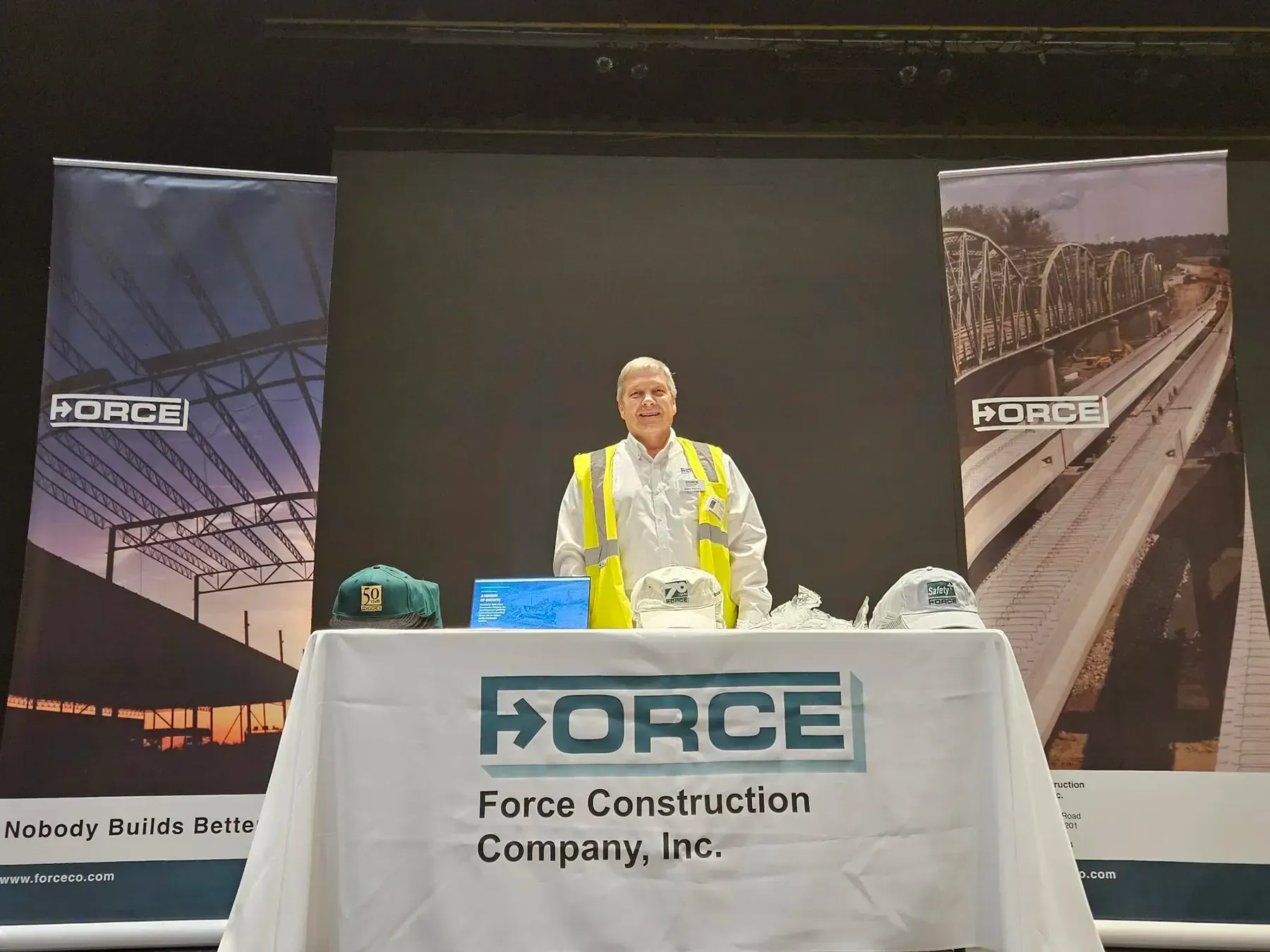 Dale Wernke with Force Construction stands at the Force booth.