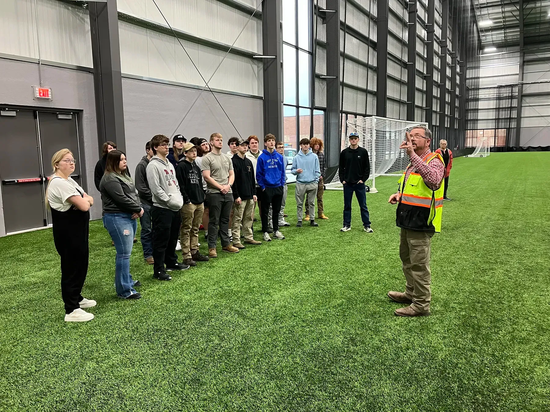 Force Construction hosting students on a tour of the Circle-K Fieldhouse.