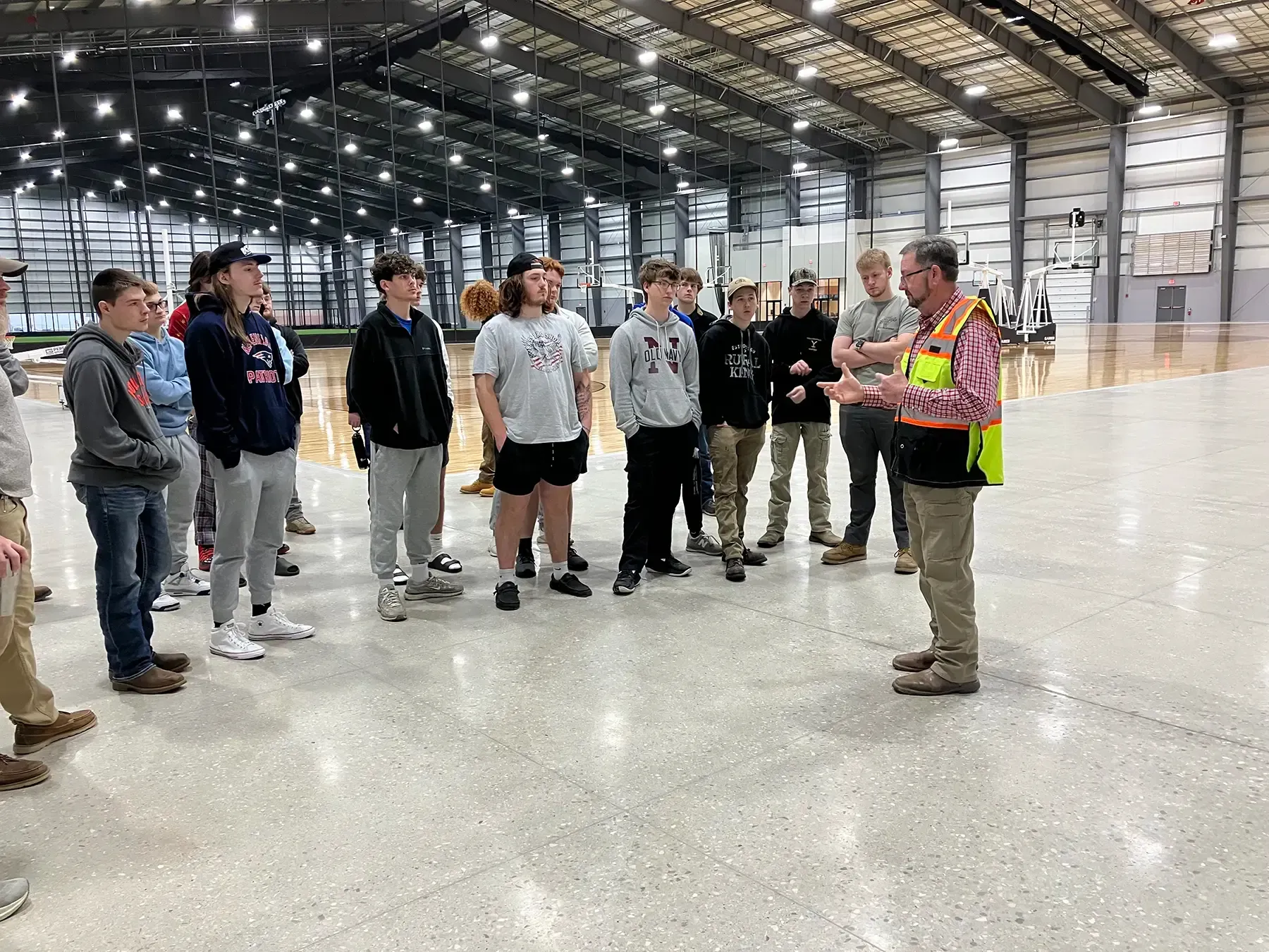 Photo of Force Construction providing a tour of the Circle-K Fieldhouse to high school students