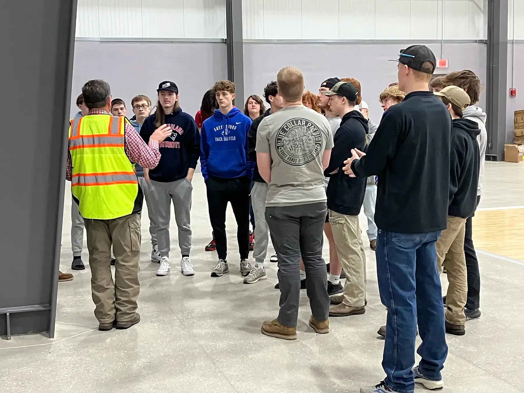 Photo of Force Construction providing a tour of the Circle-K Fieldhouse to high school students