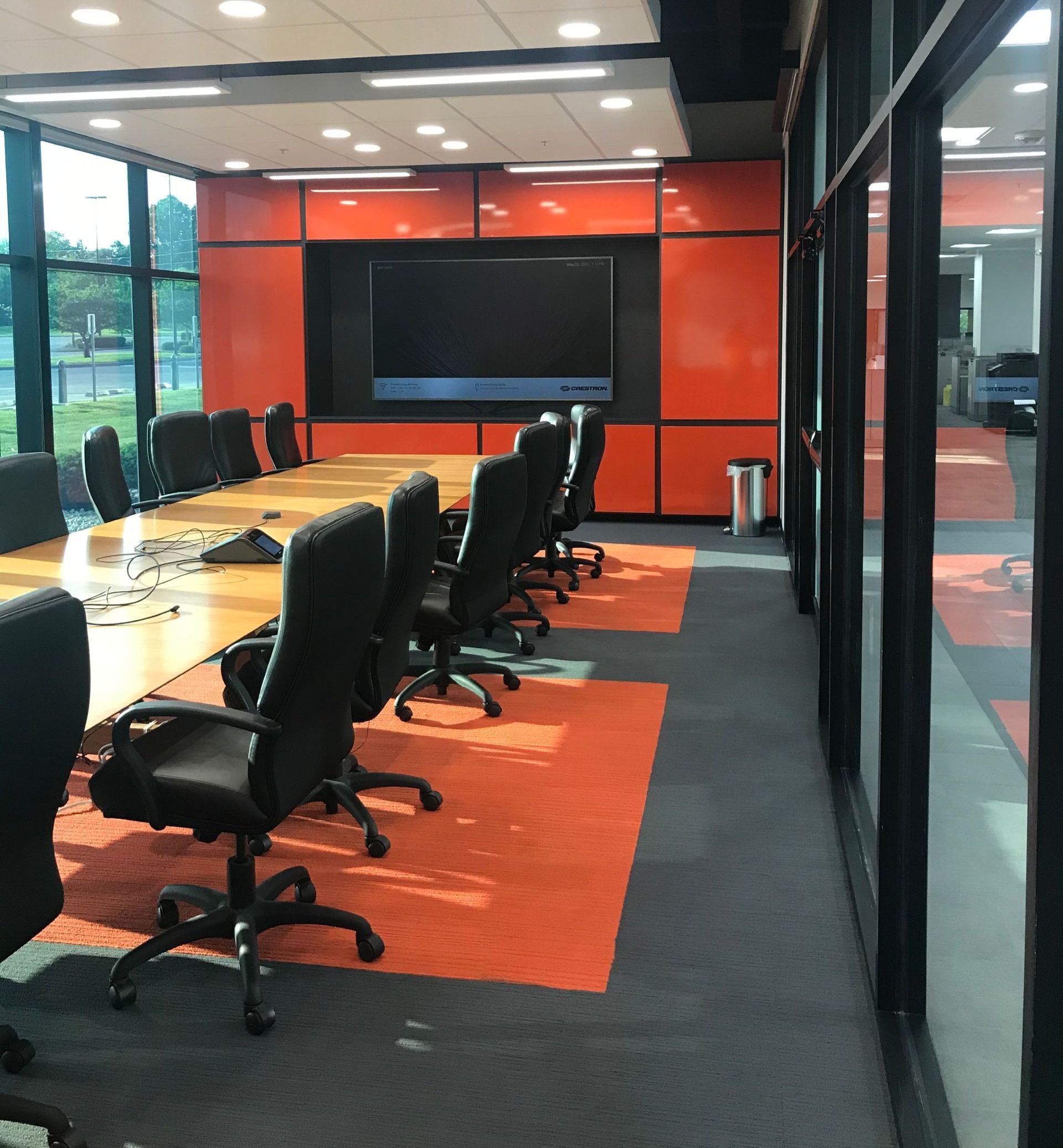 A conference room with a long table and chairs