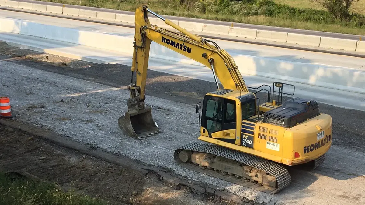 A piece of Force Construction equipment on a highway