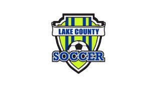 The logo for lake county soccer is a shield with a soccer ball on it.