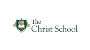 The logo for the christ school has a shield with a crown on it.