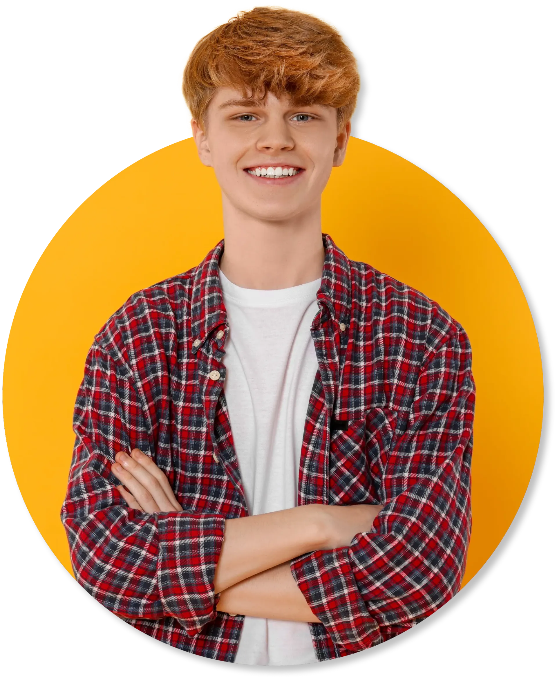 A young man with red hair is standing with his arms crossed and smiling.