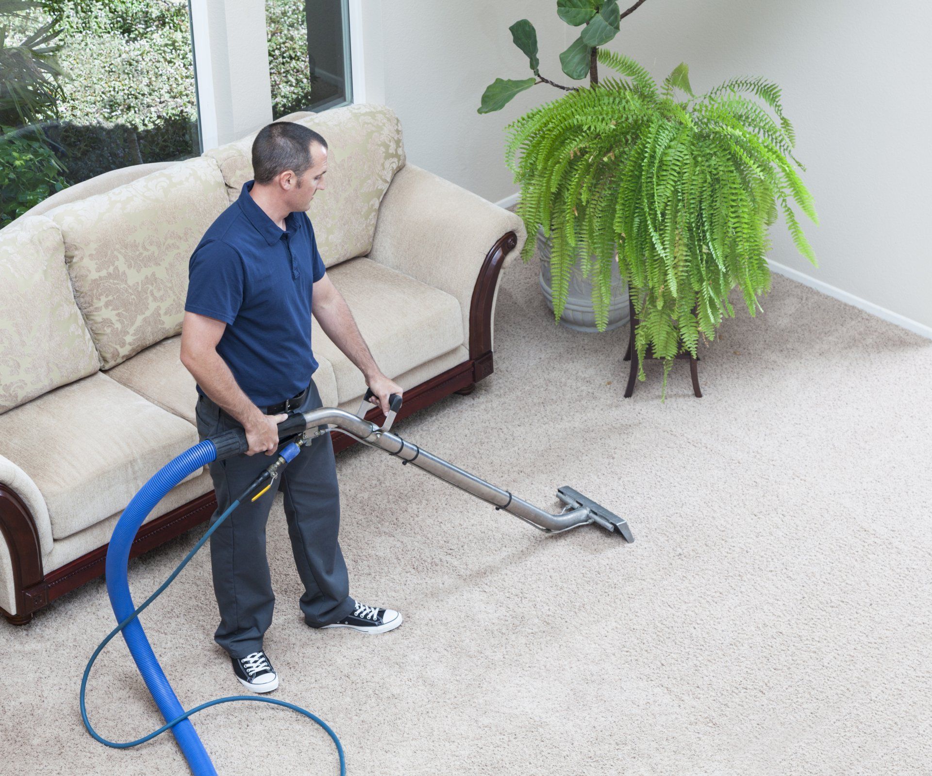 Man Cleaning Carpets In Home — Cheyenne, WY — Steam Power Inc
