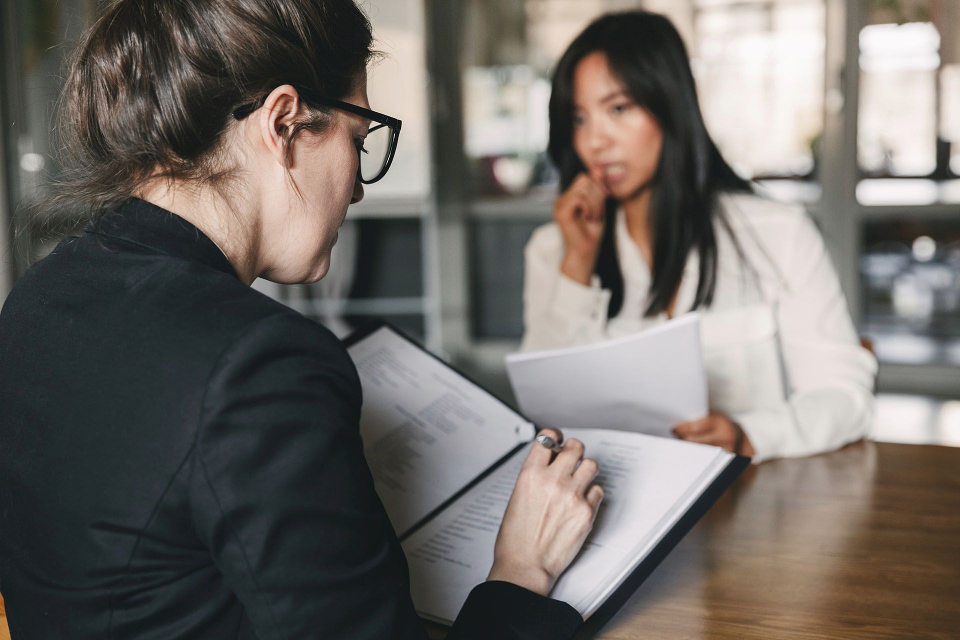 two women reviewing documents