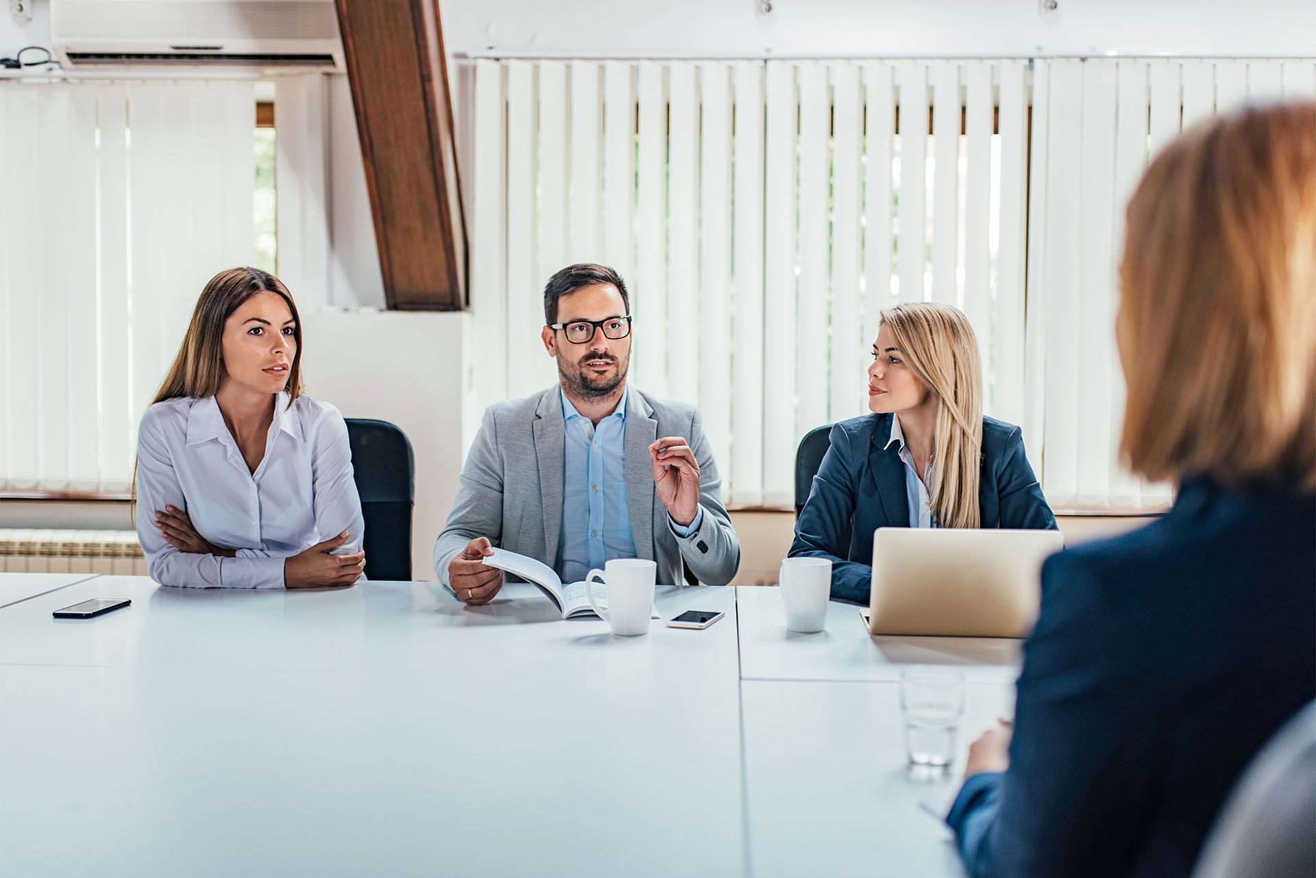 A business meeting in a bright office.