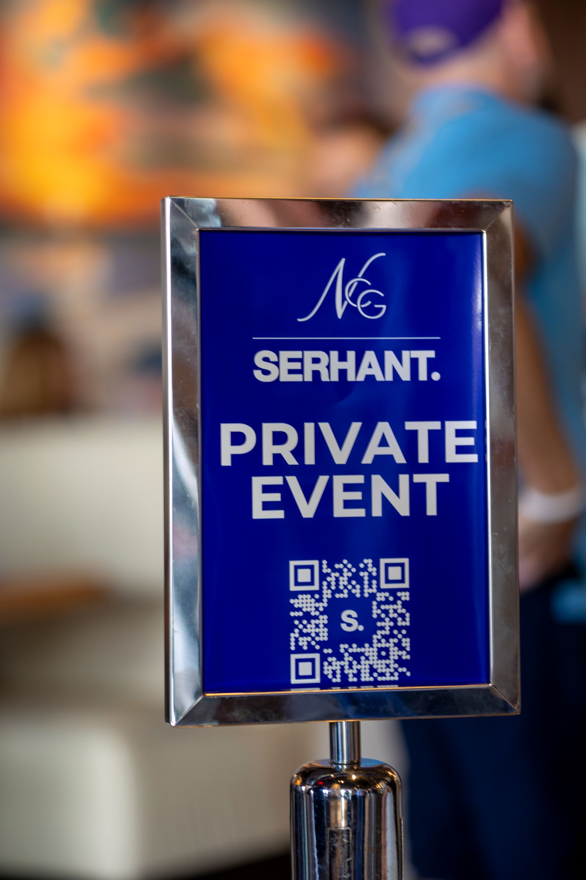 Blue and silver sign: