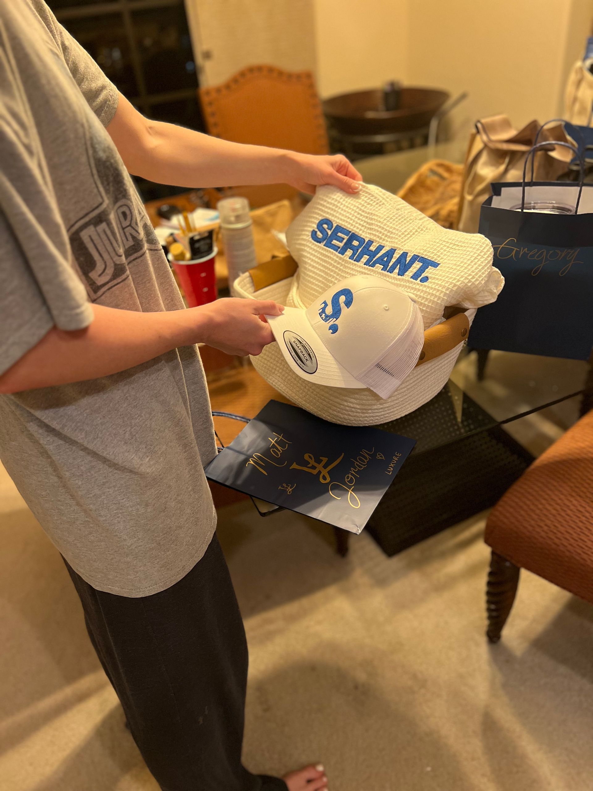 Person holding a basket with the name
