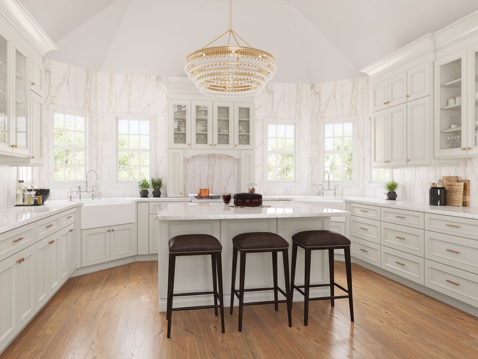 White kitchen with island, wooden floor, and a gold chandelier.